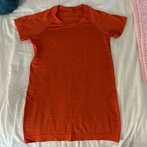 Orange Lululemon Swiftly tech top size 4